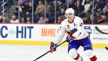 LAVAL, QC - NOVEMBER 01: Byron Froese #21 of the Laval Rocket skates the puck against the Toronto Marlies during the AHL game at Place Bell on November 1, 2017 in Laval, Quebec, Canada. The Toronto Marlies defeated the Laval Rocket 3-0. (Photo by Minas Panagiotakis/Getty Images)