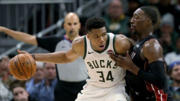 Giannis Antetokounmpo #34 of the Milwaukee Bucks dribbles the ball while being guarded by Bam Adebayo #13 of the Miami Heat (Photo by Dylan Buell/Getty Images)