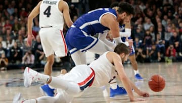 SPOKANE, WASHINGTON - NOVEMBER 19: Killian Tillie #33 of the Gonzaga Bulldogs and Ayoub Nouhi #3 of the UT Arlington Mavericks scramble for a loose ball in the second half at McCarthey Athletic Center on November 19, 2019 in Spokane, Washington. Gonzaga defeats UT Arlington 72-66. (Photo by William Mancebo/Getty Images)