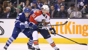 Mar 17, 2016; Toronto, Ontario, CAN; Florida Panthers defenseman Brian Campbell (51) tries to keep the puck away Toronto Maple Leafs right wing Nikita Soshnikov (41) at Air Canada Centre. The Panthers beat the Maple Leafs 4-1. Mandatory Credit: Tom Szczerbowski-USA TODAY Sports