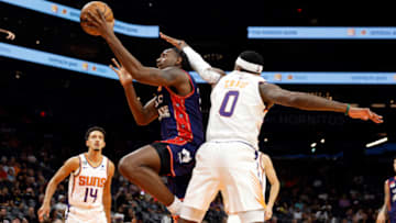 PHOENIX, ARIZONA - OCTOBER 02: Robert Franks #0 of the Adelaide 36ers shoots over Torrey Craig #0 of the Phoenix Suns during the first half at Footprint Center on October 02, 2022 in Phoenix, Arizona. NOTE TO USER: User expressly acknowledges and agrees that, by downloading and or using this photograph, User is consenting to the terms and conditions of the Getty Images License Agreement. (Photo by Chris Coduto/Getty Images)