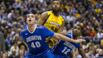 Feb 19, 2014; Milwaukee, WI, USA; Creighton Bluejays forward Zach Hanson (40), Marquette Golden Eagles forward Davante Gardner (54) and Creighton Bluejays guard Jahenns Manigat (12) during the game at BMO Harris Bradley Center. Creighton won 85-70. Mandatory Credit: Jeff Hanisch-USA TODAY Sports