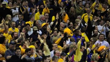 Mar 28, 2013; Washington, D.C., USA; The Marquette Golden Eagles fans cheer during the first half against the Miami Hurricanes of the semifinals of the East regional of the 2013 NCAA Tournament at the Verizon Center. Mandatory Credit: Bob Donnan-USA TODAY Sports