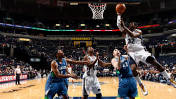 MEMPHIS, TN - JANUARY 6: O.J. Mayo #32 of the Memphis Grizzlies shoots over Kevin Love #42 of the Minnesota Timberwolves on January 6, 2009 at FedExForum in Memphis, Tennessee. NOTE TO USER: User expressly acknowledges and agrees that, by downloading and or using this photograph, User is consenting to the terms and conditions of the Getty Images License Agreement. Mandatory Copyright Notice: Copyright 2009 NBAE (Photo by Joe Murphy/NBAE via Getty Images)