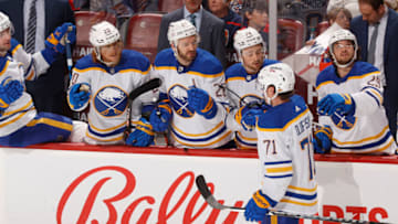 SUNRISE, FL - APRIL 8: Teammates congratulate Victor Olofsson #71 of the Buffalo Sabres after he scored a first period goal against the Florida Panthers at the FLA Live Arena on April 8, 2022 in Sunrise, Florida. (Photo by Joel Auerbach/Getty Images)