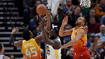 SALT LAKE CITY, UT - DECEMBER 19: Draymond Green #23 of the Golden State Warriors blocks the shot by Donovan Mitchell #45 of the Utah Jazz in the first half of a NBA game at Vivint Smart Home Arena on December 19, 2018 in Salt Lake City, Utah. (Photo by Gene Sweeney Jr./Getty Images)