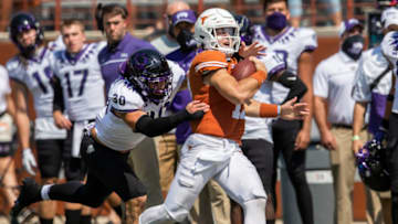 Texas Longhorns quarterback Sam Ehlinger (11) runs against TCU Horned Frogs linebacker Garret Wallow (30) in the 3rd quarter in a NCAA college football game at Darrell K Royal-Texas Memorial Stadium. Mandatory Credit: Ricardo B. Brazziell-USA TODAY Sports