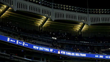 NEW YORK, NY - APRIL 10: Fans hold up their cell phones after a bank of lights went out in the 12 inning during the game between the New York Yankees and the Boston Red Sox on April 10, 2015 at Yankee Stadium in the Bronx borough of New York City. (Photo by Elsa/Getty Images)