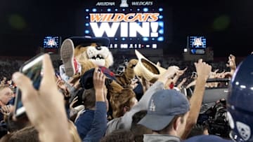 Nov 14, 2015; Tucson, AZ, USA; Arizona Wildcats mascot Wilbur surfs the crowd as students rush the field after defeating the Utah Utes at Arizona Stadium. Arizona won 37-30 in double overtime. Mandatory Credit: Casey Sapio-USA TODAY Sports