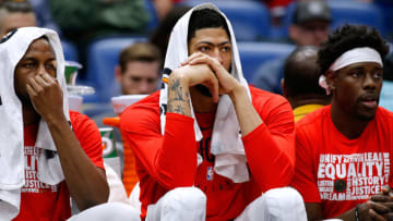 NEW ORLEANS, LOUISIANA - FEBRUARY 12: Anthony Davis #23 of the New Orleans Pelicans, Jrue Holiday #11 and Darius Miller #21 react during the second half against the Orlando Magic at the Smoothie King Center on February 12, 2019 in New Orleans, Louisiana. NOTE TO USER: User expressly acknowledges and agrees that, by downloading and or using this photograph, User is consenting to the terms and conditions of the Getty Images License Agreement. (Photo by Jonathan Bachman/Getty Images)