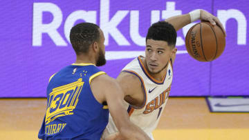 Stephen Curry and Devin Booker, Phoenix Suns(Photo by Thearon W. Henderson/Getty Images)