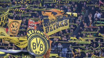 DORTMUND, GERMANY - NOVEMBER 20: Fans of Borussia Dortmund during the Bundesliga match between Borussia Dortmund and VfB Stuttgart at Signal Iduna Park on November 20, 2021 in Dortmund, Germany. (Photo by Alex Grimm/Getty Images)