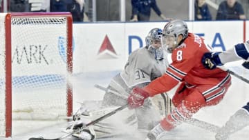 Ohio State's Dakota Joshua (8) knocks the puck in for a goal around Penn State's Peyton Jones at Pegula Ice Arena in University Park, Pa., on Saturday, Jan. 21, 2017. Ohio State won, 6-3. (Abby Drey/Centre Daily Times/TNS via Getty Images)