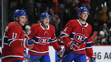 MONTREAL, QC - JANUARY 12: Jesperi Kotkaniemi #15, Brendan Gallagher #11 and Mike Reilly #28 of the Montreal Canadiens celebrate after scoring a goal against the Colorado Avalanche in the NHL game at the Bell Centre on January 12, 2019 in Montreal, Quebec, Canada. (Photo by Francois Lacasse/NHLI via Getty Images)