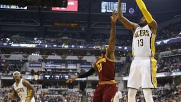 Feb 1, 2016; Indianapolis, IN, USA; Indiana Pacers forward Paul George (13) shoots the ball over Cleveland Cavaliers forward LeBron James (23) during the first half at Bankers Life Fieldhouse. Mandatory Credit: Brian Spurlock-USA TODAY Sports