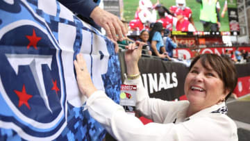 GLENDALE, AZ - DECEMBER 10: Amy Adams Strunk owner of the Tennessee Titans smiles while signing autographs for a fan prior to the NFL game between the Tennessee Titans and Arizona Cardinals at University of Phoenix Stadium on December 10, 2017 in Glendale, Arizona. (Photo by Christian Petersen/Getty Images)