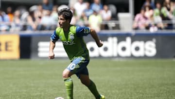 Jul 31, 2016; Seattle, WA, USA; Seattle Sounders midfielder Nicolas Lodeiro (10) dribbles the ball against the Los Angeles Galaxy during the second half at CenturyLink Field. Seattle tied Los Angeles 1-1. Mandatory Credit: Jennifer Buchanan-USA TODAY Sports