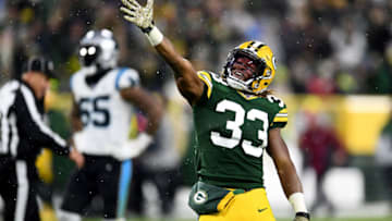 GREEN BAY, WISCONSIN - NOVEMBER 10: Aaron Jones #33 of the Green Bay Packers celebrates a first down against the Carolina Panthers during the third quarter in the game at Lambeau Field on November 10, 2019 in Green Bay, Wisconsin. (Photo by Stacy Revere/Getty Images)