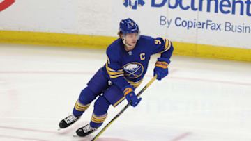 Feb 15, 2021; Buffalo, New York, USA; Buffalo Sabres center Jack Eichel (9) looks to make a pass during the first period against the New York Islanders at KeyBank Center. Mandatory Credit: Timothy T. Ludwig-USA TODAY Sports