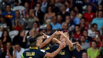 Monaco's Polish defender Kamil Glik (R) celebrates with team mates after scoring a goal during the French L1 football match between Lille OSC (LOSC) and AS Monaco FC (ASMFC) at the Pierre-Mauroy Stadium in Villeneuve d'Ascq, near Lille, northern France, on September 10, 2016. / AFP / PHILIPPE HUGUEN (Photo credit should read PHILIPPE HUGUEN/AFP/Getty Images)