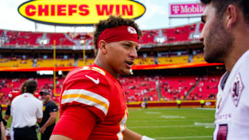 Aug 20, 2022; Kansas City, Missouri, USA; Kansas City Chiefs quarterback Patrick Mahomes (15) talks with Washington Commanders quarterback Sam Howell (14) after the game at GEHA Field at Arrowhead Stadium. Mandatory Credit: Jay Biggerstaff-USA TODAY Sports