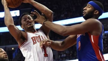 Nov 10, 2014; Chicago, IL, USA; Chicago Bulls guard Derrick Rose (1) is fouled by Detroit Pistons center Andre Drummond (0) during the third quarter at the United Center. The Chicago Bulls defeated the Detroit Pistons 102-91. Mandatory Credit: David Banks-USA TODAY Sports