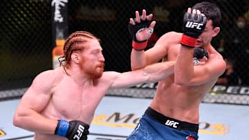 LAS VEGAS, NEVADA - MAY 30: In this handout provided by UFC, (L-R) Spike Carlyle punches Billy Quarantillo in their fight during the UFC Fight Night event at UFC APEX on May 30, 2020 in Las Vegas, Nevada. (Photo by Jeff Bottari/Zuffa LLC via Getty Images)
