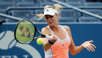 Aug 31, 2013; New York, NY, USA; Maria Kirilenko (RUS) returns a shot to Simona Halep (ROU) on Armstrong Stadium on day six of the 2013 US Open at the Billie Jean King National Tennis Center. Mandatory Credit: Anthony Gruppuso-USA TODAY Sports
