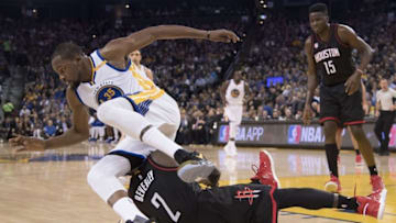 December 1, 2016; Oakland, CA, USA; Golden State Warriors forward Kevin Durant (35) fouls Houston Rockets guard Patrick Beverley (2) during the third quarter at Oracle Arena. The Rockets defeated the Warriors 132-127 in double overtime. Mandatory Credit: Kyle Terada-USA TODAY Sports