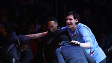 LOS ANGELES, CA - MARCH 10: (L-R) Jawun Evans