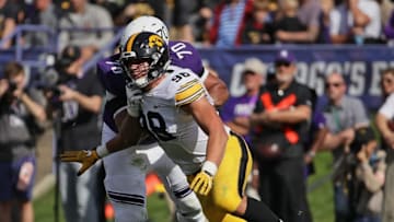 EVANSTON, IL - OCTOBER 21: Anthony Nelson #98 of the Iowa Hawkeyes rushes against Rashawn Slater #70 of the Northwestern Wildcats at Ryan Field on October 21, 2017 in Evanston, Illinois. Northwestern defeated Iowa 17-10 in overtime. (Photo by Jonathan Daniel/Getty Images)