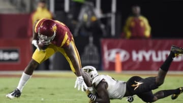 Oct 1, 2016; Los Angeles, CA, USA; Southern California Trojans wide receiver JuJu Smith-Schuster (9) avoids a tackle by Arizona State Sun Devils defensive back Gump Hayes (8) for a touchdown during the second half at Los Angeles Memorial Coliseum. Mandatory Credit: Kelvin Kuo-USA TODAY Sports