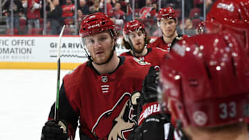 GLENDALE, AZ - JANUARY 04: Christian Fischer #36 of the Arizona Coyotes is congratulated by teammates after scoring a goal against the New Jersey Devils during the second period at Gila River Arena on January 4, 2019 in Glendale, Arizona. (Photo by Norm Hall/NHLI via Getty Images)