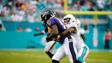 06 December 2015: Baltimore Ravens Wide Receiver Jeremy Butler (17) runs with ball and is tackled by Miami Dolphins Cornerback Brice McCain (24) during the NFL football game between the Baltimore Ravens and the Miami Dolphins at the Sun Life Stadium in Miami Gardens, Florida. (Photo by Doug Murray/Icon Sportswire) (Photo by Doug Murray/Icon Sportswire/Corbis via Getty Images)