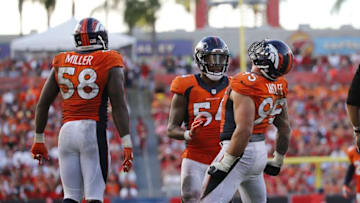 Oct 2, 2016; Tampa, FL, USA; Denver Broncos defensive end Derek Wolfe (95) celebrates with inside linebacker Brandon Marshall (54) and outside linebacker Von Miller (58) after he sacked Tampa Bay Buccaneers quarterback Jameis Winston (3) (not pictured) during the second half at Raymond James Stadium. Mandatory Credit: Kim Klement-USA TODAY Sports