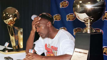 SALT LAKE CITY, UNITED STATES: Michael Jordan of the Chicago Bulls talks to the media 14 June after winning game six of the NBA Finals against the Utah Jazz at the Delta Center in Salt Lake City, UT. The Bulls won the game 87-86 to win their sixth NBA Championship. AFP PHOTO/Mike NELSON (Photo credit should read MIKE NELSON/AFP via Getty Images)
