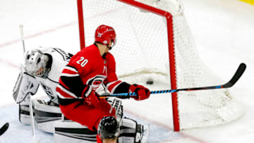 The Carolina Hurricanes' Sebastian Aho (20) puts the puck past the Los Angeles Kings' Darcy Kuemper (35) for a goal during the third period at PNC Arena in Raleigh, N.C., on Tuesday, Feb. 13, 2018. The Canes won, 7-3. (Chris Seward/Raleigh News & Observer/TNS via Getty Images)