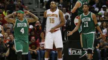 ATLANTA, GA - APRIL 19: Boston Celtics guard guard Isaiah Thomas, left, reacts after he is called for fouling Atlanta Hawks forward Thabo Sefolosha, not pictured, on a three point shot as Hawks center Al Horford looks on while Celtics guard Evan Turner, right, reacts during the second half of Game 2 in the first round of the NBA Eastern Conference playoffs at Philips Arena in Atlanta on April 19, 2016. (Photo by Jessica Rinaldi/The Boston Globe via Getty Images)