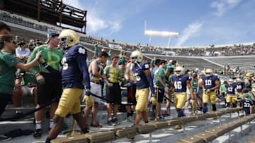 Sep 26, 2015; South Bend, IN, USA; Notre Dame Fighting Irish players walk through the student section before warming up against the Massachusetts Minutemen at Notre Dame Stadium. Mandatory Credit: Brian Spurlock-USA TODAY Sports