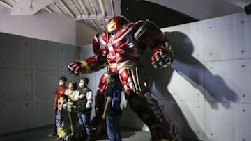 JAKARTA, JUNE 15 : Visitors take pictures with the Iron Man Hulkbuster costumes on display during Marvel Studios Exhibition in Jakarta, Indonesia on June 15, 2022. The exhibition is claimed by the organizers to be the largest in Southeast Asia, featuring a complete collection of original movie props, costumes, and concept art from Marvel films. (Photo by Agoes Rudianto/Anadolu Agency via Getty Images)