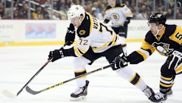 Dec 18, 2015; Pittsburgh, PA, USA; Boston Bruins center Frank Vatrano (72) battles for the puck with Pittsburgh Penguins defenseman David Warsofsky (5) during the first period at the CONSOL Energy Center. Mandatory Credit: Charles LeClaire-USA TODAY Sports