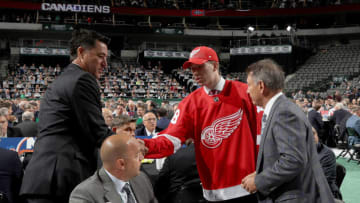 DALLAS, TX - JUNE 23: Jared McIsaac reacts after being selected 36th overall by the Detroit Red Wings during the 2018 NHL Draft at American Airlines Center on June 23, 2018 in Dallas, Texas. (Photo by Bruce Bennett/Getty Images)