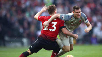 MANCHESTER, ENGLAND - FEBRUARY 24: James Milner of Liverpool battles for possession with Luke Shaw of Manchester United during the Premier League match between Manchester United and Liverpool FC at Old Trafford on February 24, 2019 in Manchester, United Kingdom. (Photo by Clive Brunskill/Getty Images)