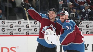 DENVER, CO - APRIL 2: Sven Andrighetto #10 and Philipp Grubauer #31 of the Colorado Avalanche celebrate after a win against the Edmonton Oilers at the Pepsi Center on April 2, 2019 in Denver, Colorado. The Avalanche defeated the Oilers 6-2. (Photo by Michael Martin/NHLI via Getty Images)