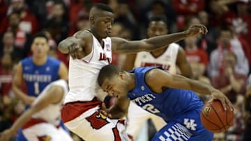Dec 27, 2014; Louisville, KY, USA; Kentucky Wildcats guard Aaron Harrison (2) dribbles against Louisville Cardinals guard Terry Rozier (0) during the second half at KFC Yum! Center. Kentucky defeated Louisville 58-50. Mandatory Credit: Jamie Rhodes-USA TODAY Sports