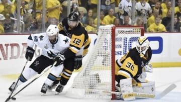 May 30, 2016; Pittsburgh, PA, USA; San Jose Sharks center Patrick Marleau (12) controls the puck behind the net of Pittsburgh Penguins defenseman Ben Lovejoy (12) and goalie Matt Murray (30) in the third period in game one of the 2016 Stanley Cup Final at Consol Energy Center. Mandatory Credit: Don Wright-USA TODAY Sports