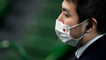 MIKI, JAPAN - MARCH 06: A staff member wearing a face mask is seen during the singles match between Yasutaka Uchiyama of Japan and Roberto Quiroz of Ecuador on day one of the Davis Cup qualifier between Japan and Ecuador at the Bourbon Beans Dome on March 6, 2020 in Miki, Hyogo, Japan. The 2-day qualifier is held behind closed doors due to novel coronavirus outbreak. (Photo by Kiyoshi Ota/Getty Images)