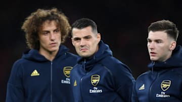 LONDON, ENGLAND - NOVEMBER 28: (L-R) David Luiz, Granit Xhaka and Kieran Tierney of Arsenal look on they line up ahead of the UEFA Europa League group F match between Arsenal FC and Eintracht Frankfurt at Emirates Stadium on November 28, 2019 in London, United Kingdom. (Photo by Shaun Botterill/Getty Images)