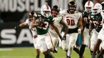 MIAMI, FLORIDA - NOVEMBER 09: Cam'Ron Harris #23 of the Miami Hurricanes runs with the ball against the Louisville Cardinals during the second half at Hard Rock Stadium on November 09, 2019 in Miami, Florida. (Photo by Michael Reaves/Getty Images)