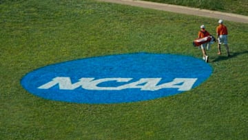 FAYETTEVILLE, AR - MAY 27: A Clemson golfer walks by the NCAA Photos via Getty Images logo painted on the grass during the Division I Men's Golf Stroke Play Championship held at the Blessings Golf Club on May 27, 2019 in Fayetteville, Arkansas. (Photo by Jack Dempsey/NCAA Photos via Getty Images)